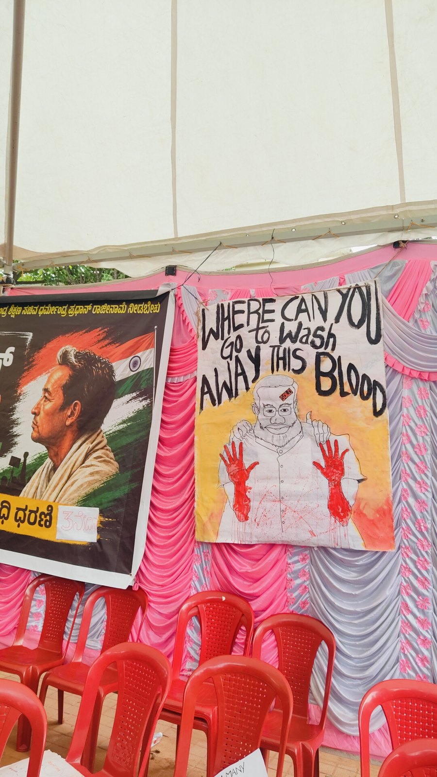 Painted banners on a tent wall at Freedom Park, Bengaluru
