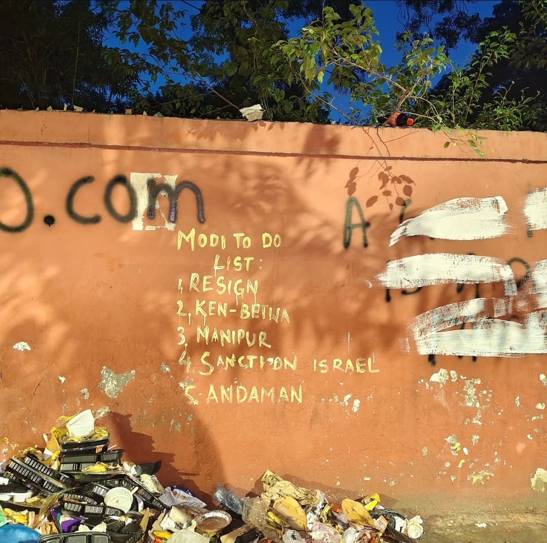 Graffiti on a wall listing a five-point to-do list addressed to the Prime Minister
