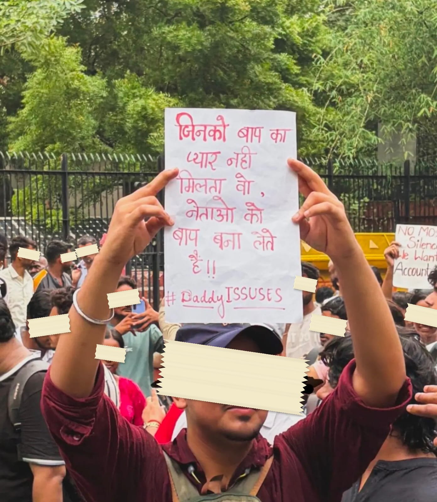 A hand-lettered placard in Hindi, signed with the hashtag Daddy Issues