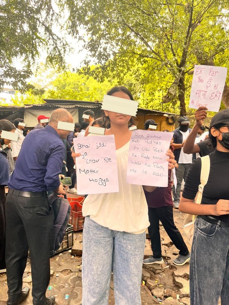 A placard at the Ranchi sit-in reading Mines becho, bachchon ka career nahi — kuchu puchuu tum kahaan ho?
